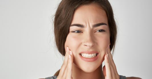 Image showing a patient experiencing Invisalign jaw pain.
